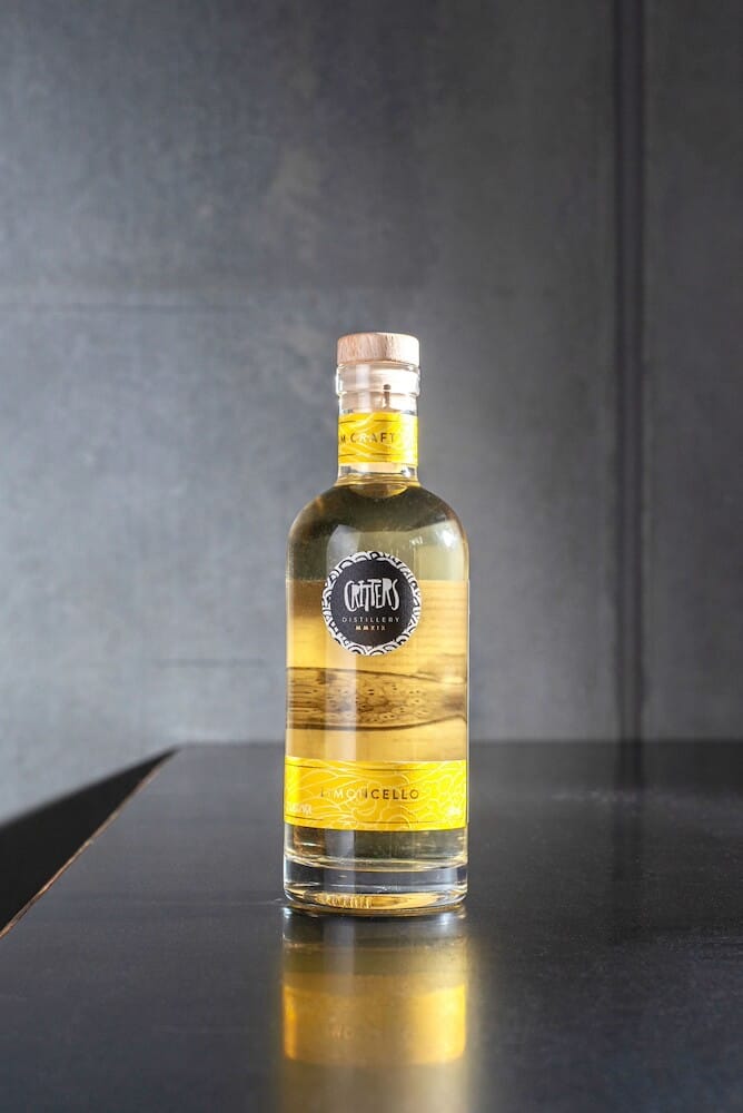 Critters Distillery Limoncello front on bench Critters Distillery Limoncello front on bench