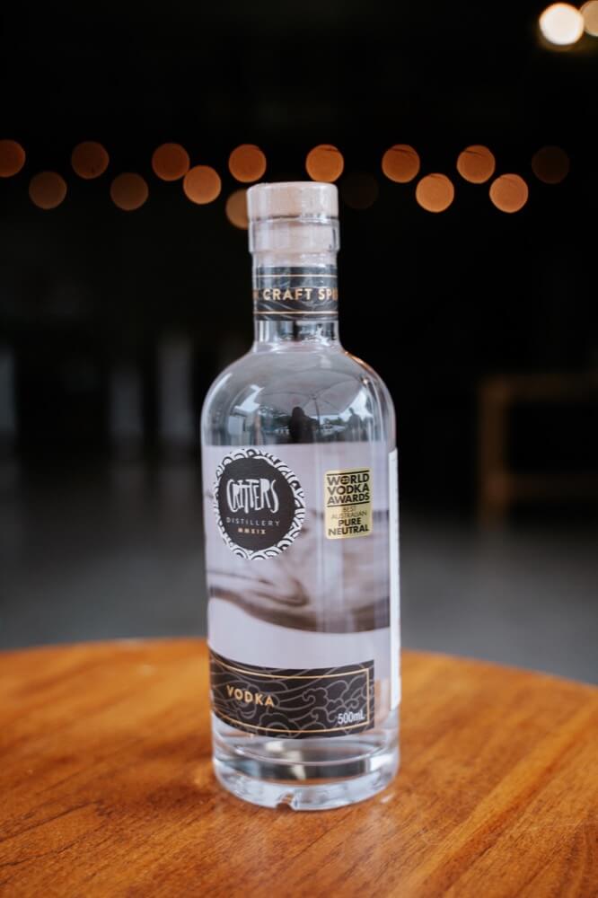 Critters Distillery Vodka presented on table in the spotlight Critters Distillery Vodka presented on table in the spotlight